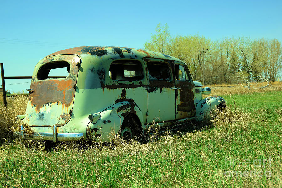 An old van in the bushes Photograph by Jeff Swan