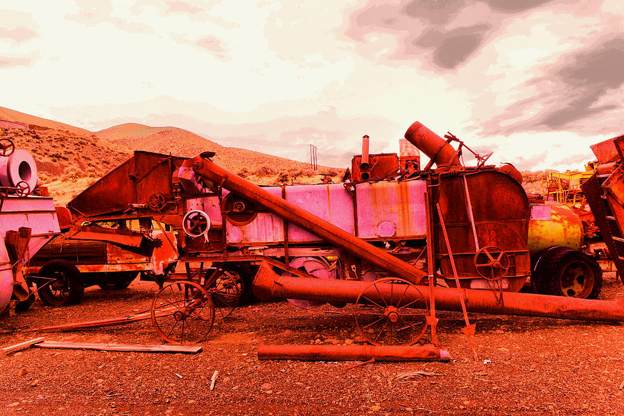 An old rusty harvestor Photograph by Jeff Swan
