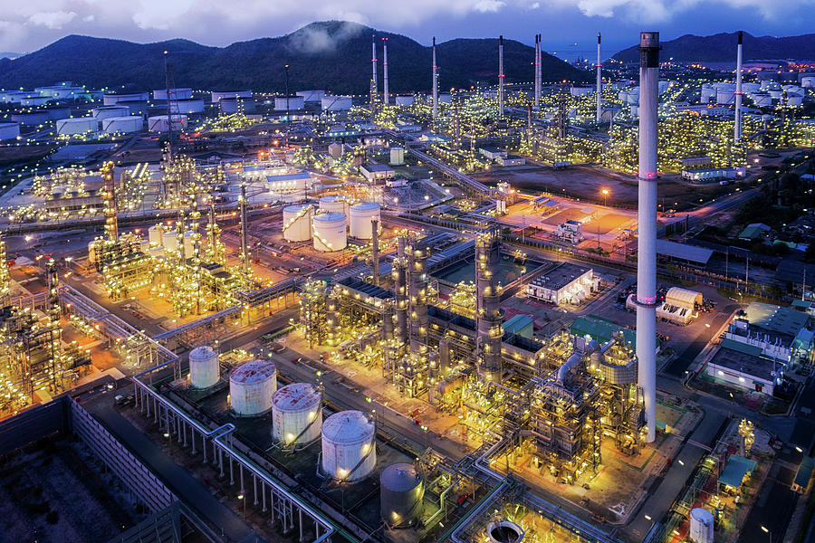 and scape of Oil refinery plant from bird eye view on night Photograph by Anek Suwannaphoom