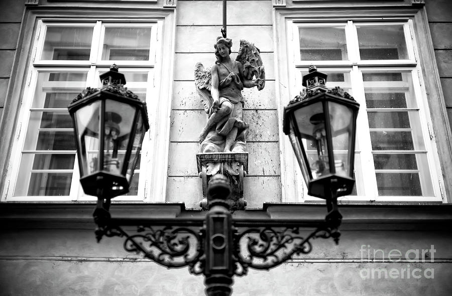 Angel Between the Lamp Post in Prague Photograph by John Rizzuto