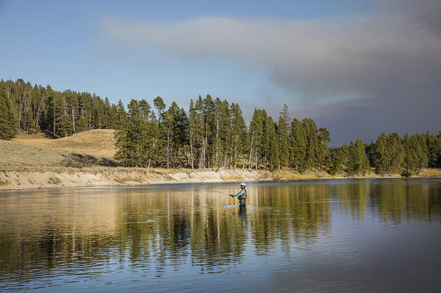 Angler amidst gorgeous surroundings and a calm river in the Yellowstone in Wyoming Photograph by Carol M Highsmith