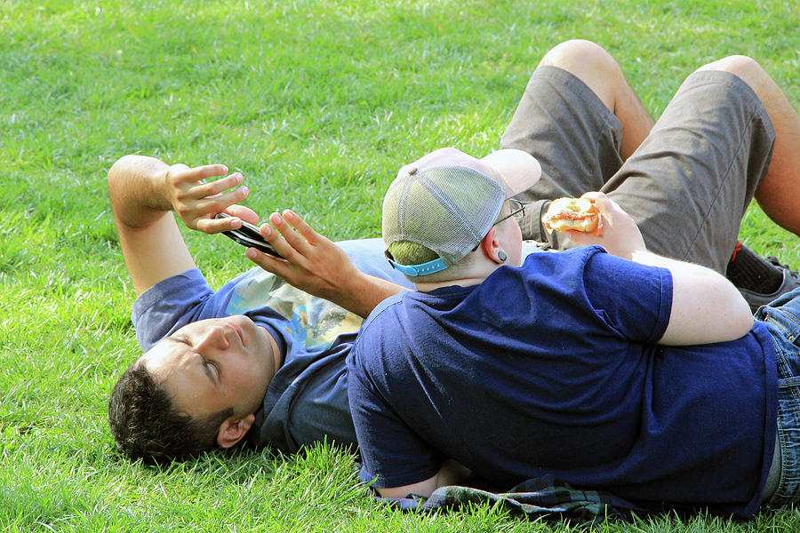Another Shot Of 2 Guys On The Grass Photograph by Cora Wandel