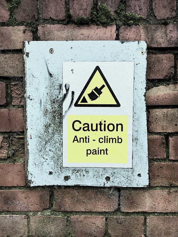 Anti-climb paint warning Photograph by Tom Gowanlock
