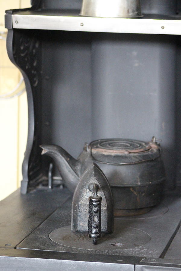 Antique Cast Iron Clothing Press on Wood Stove Photograph by Colleen Cornelius