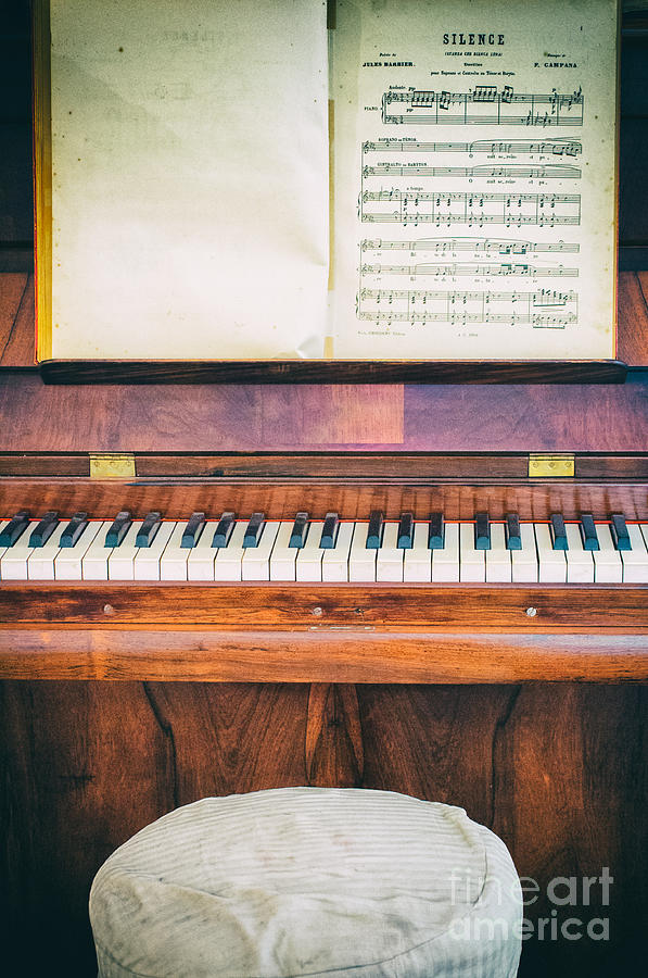 Key Photograph - Antique piano and music sheet by Silvia Ganora