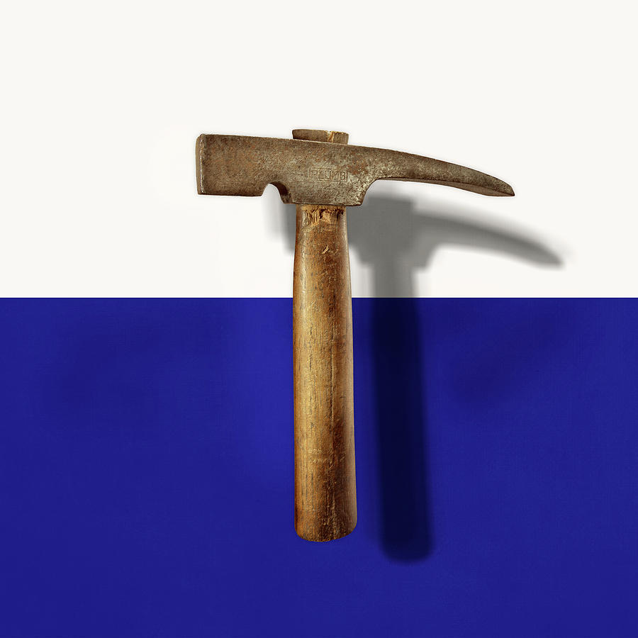Antique Plumb Masonry Hammer on Color Paper Photograph by YoPedro