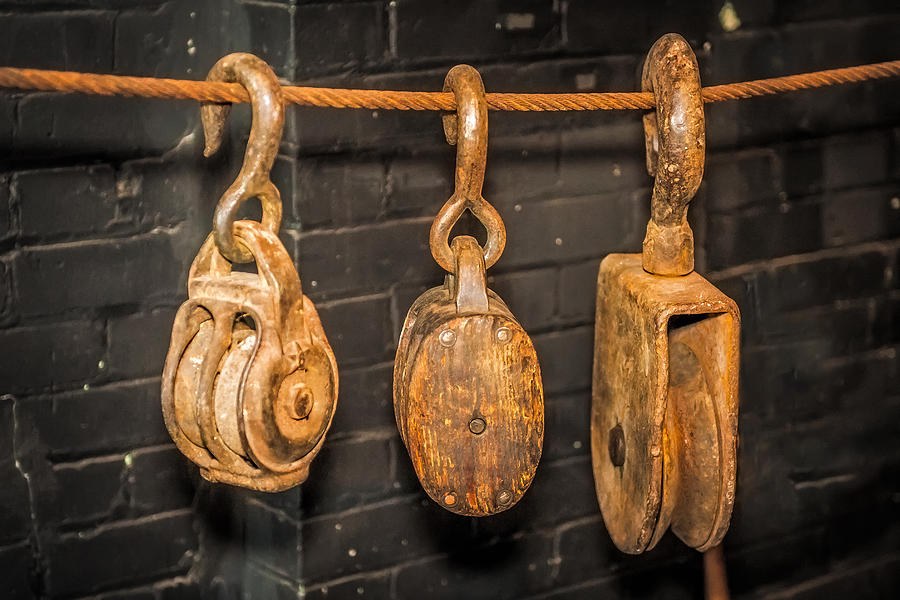Antique Pulleys Photograph by Paul Freidlund