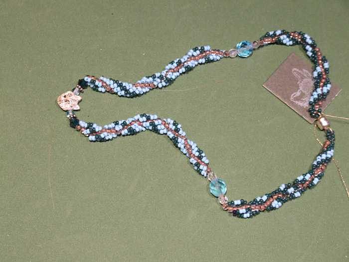 Aqua and green rope weave with fox pendant Jewelry by Susan Anderson Aqua and green rope weave with fox pendant Jewelry by Susan Anderson