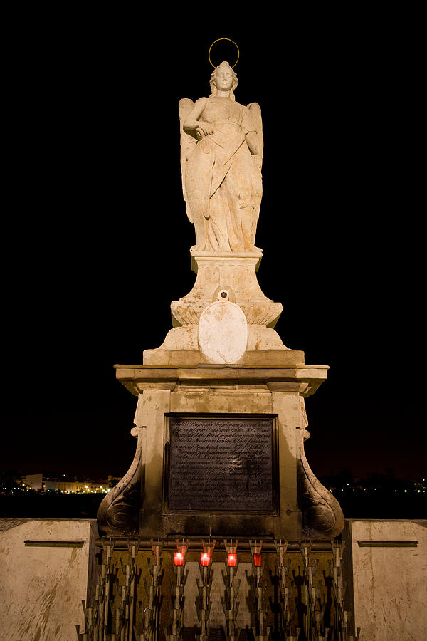 Archangel Saint Raphael Statue at Night in Cordoba Photograph by Artur Bogacki