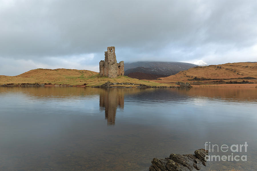 Ardvreck Castle reflecting in Loch Assynt Photograph by Maria Gaellman
