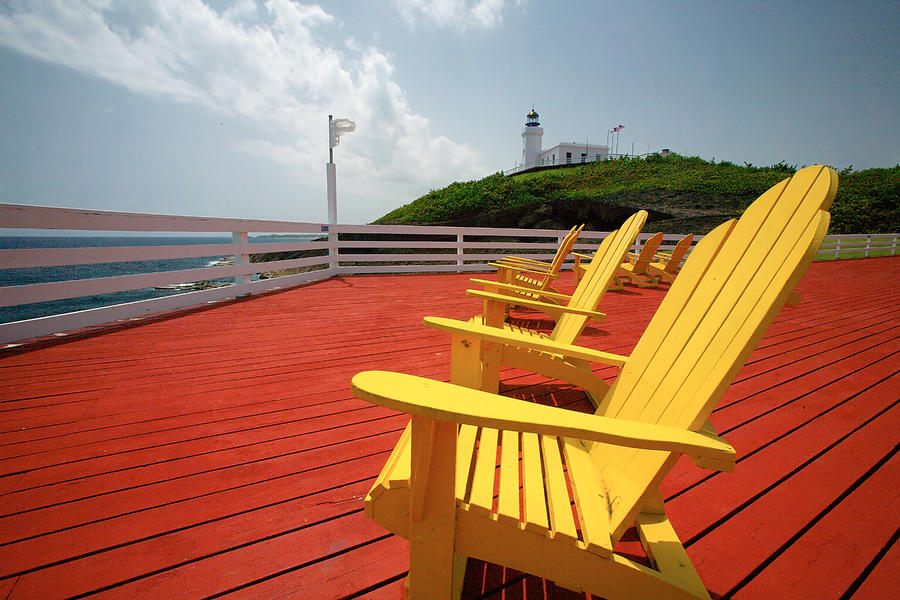 Architecture Photograph - Arecibo Lighthouse with Yellow Chairs by George Oze