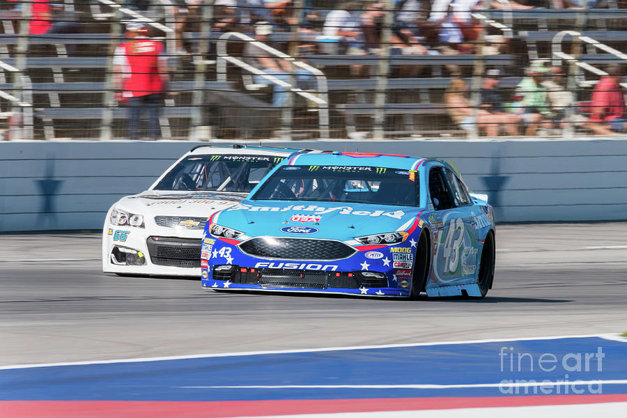 Aric Almirola trying to keep his lead Photograph by Paul Quinn