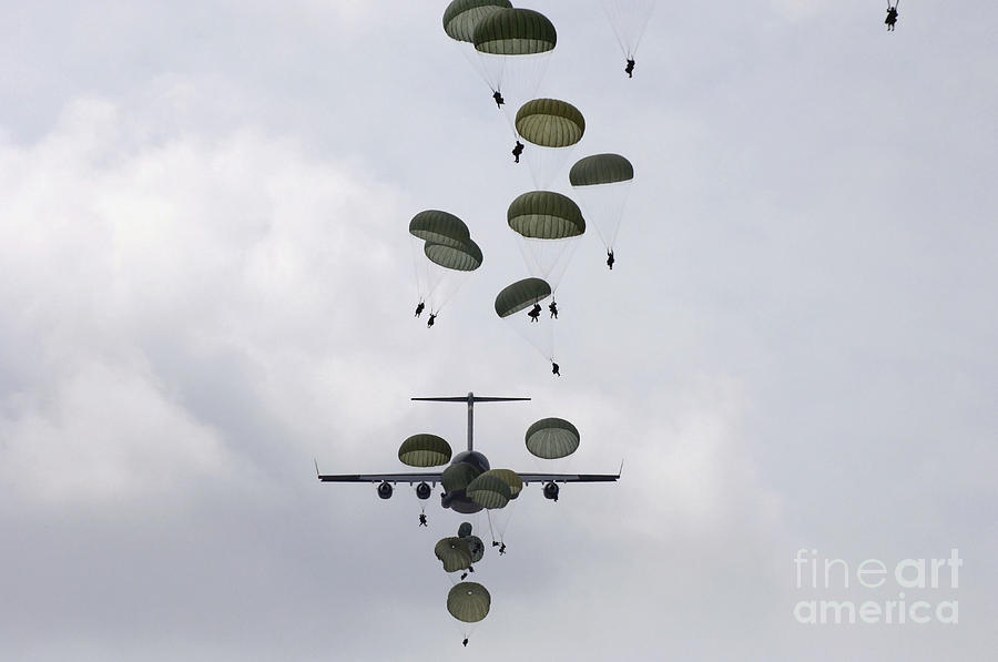 Army Soldiers Jump Out Of A C-17 Photograph by Stocktrek Images