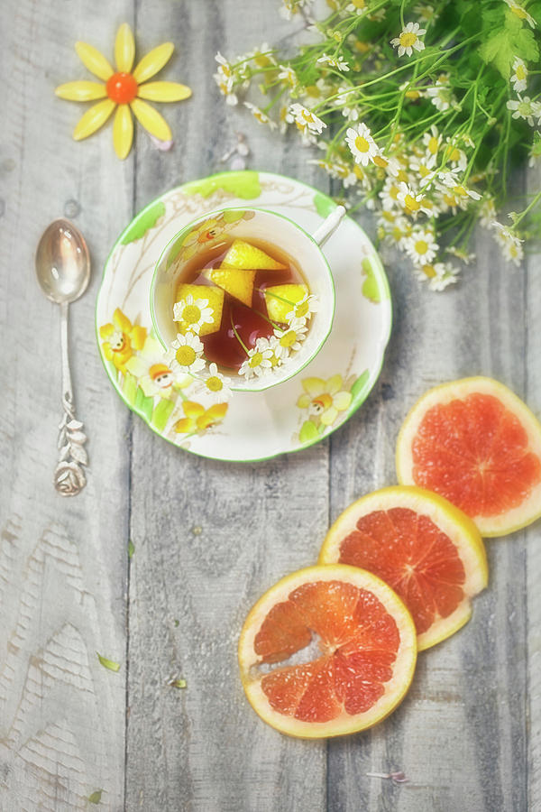 Art Deco Tea Cup with Grapefruit and Daisies Photograph by Susan Gary