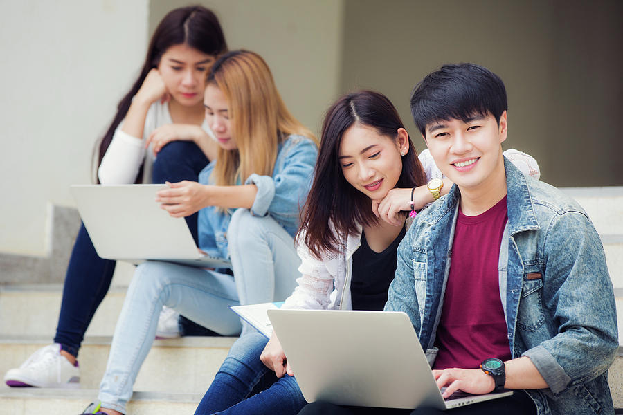 Asia student group in university work hard togather for make a r Photograph  by Anek Suwannaphoom