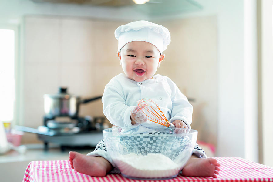 Asian baby in kitchen, newborn baby concept for job Photograph by Anek Suwannaphoom