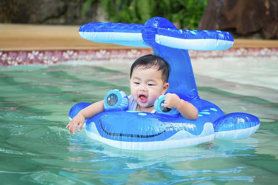 Asian baby play a water and swimming Photograph by Anek Suwannaphoom