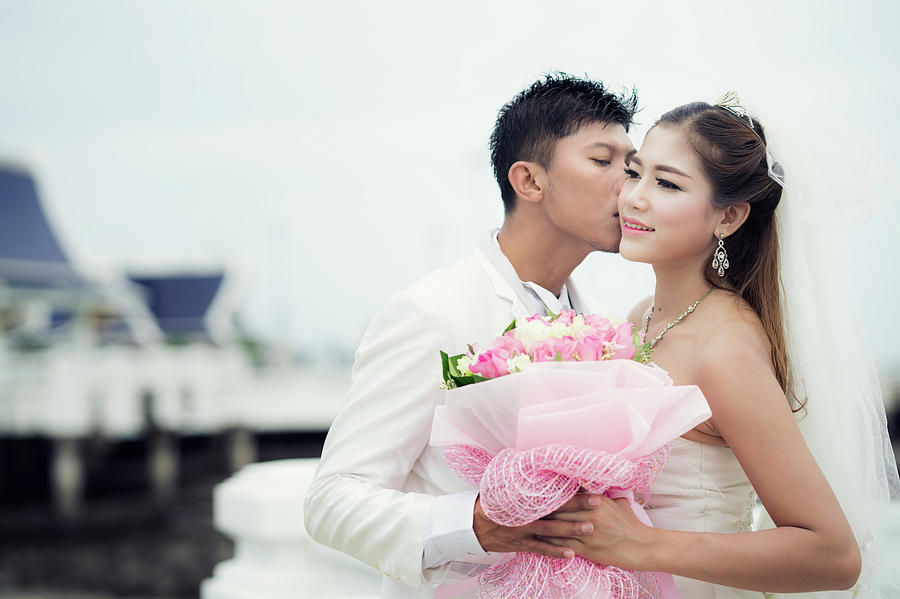 Asian Couple Just Marriage Kiss In Bridge Photograph By Anek Suwannaphoom