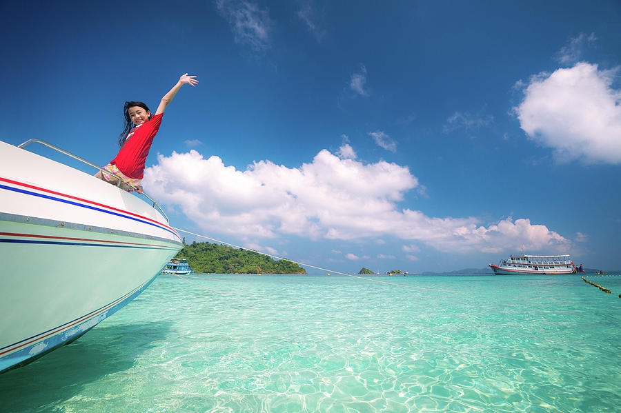Asian girl on speed boat between sea travel trip Photograph by Anek Suwannaphoom