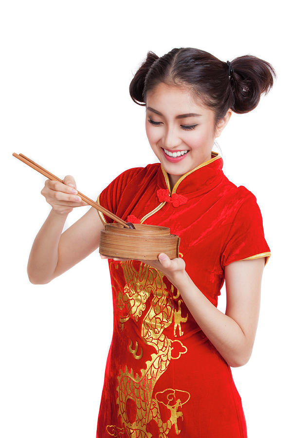 Asian lady in chinese dress eat dim sum i Photograph by Anek Suwannaphoom