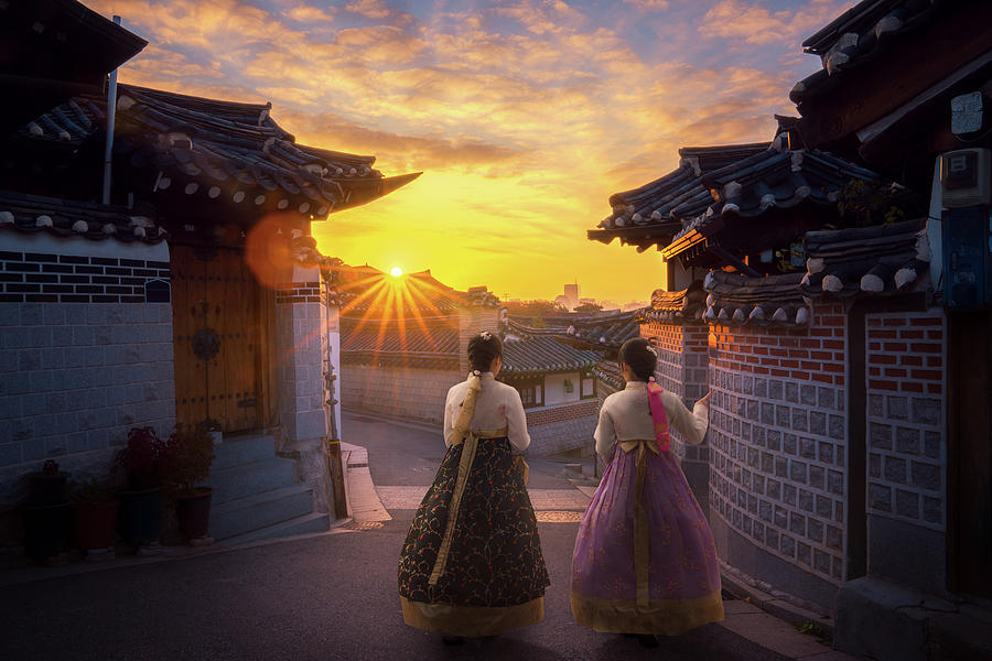 Asian lady in Hanbok dress walk togather in Korea old city  Photograph by Anek Suwannaphoom