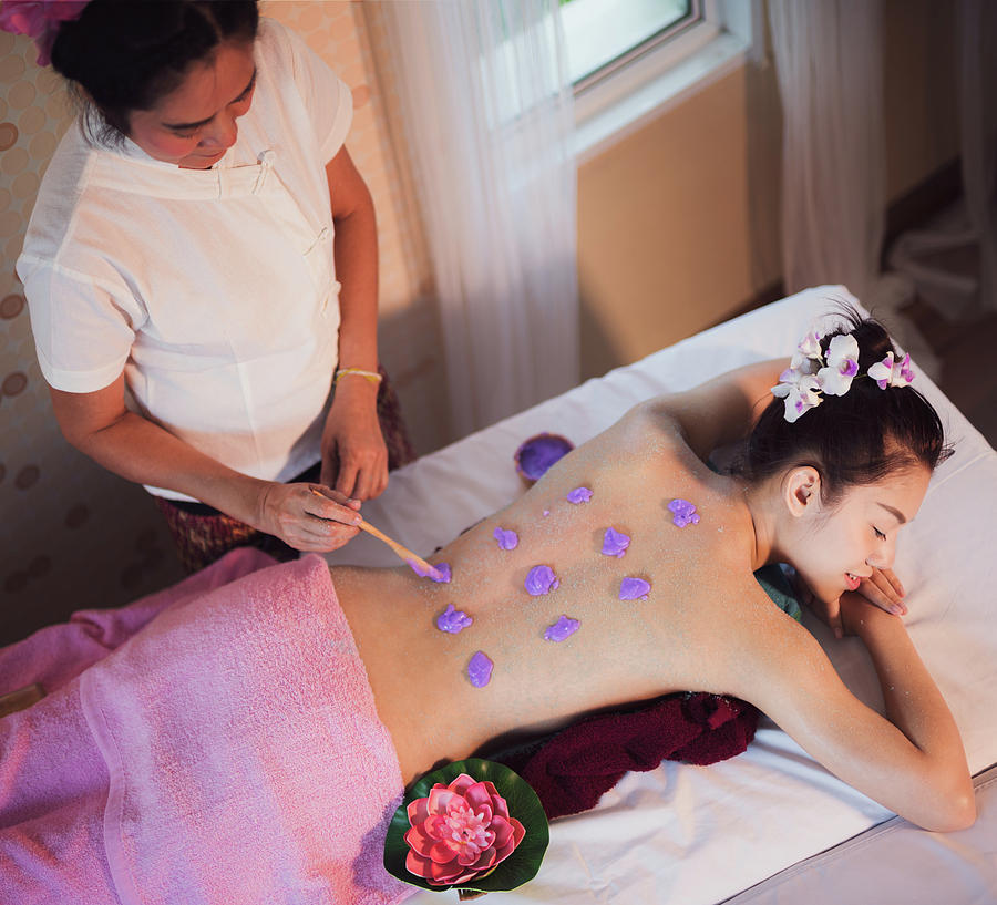 Asian lady relax in skin care aroma therapy and  scrub spa Photograph by Anek Suwannaphoom