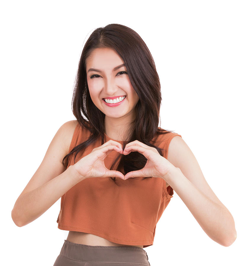 Asian pretty girl and hand with heart symbol  Photograph by Anek Suwannaphoom