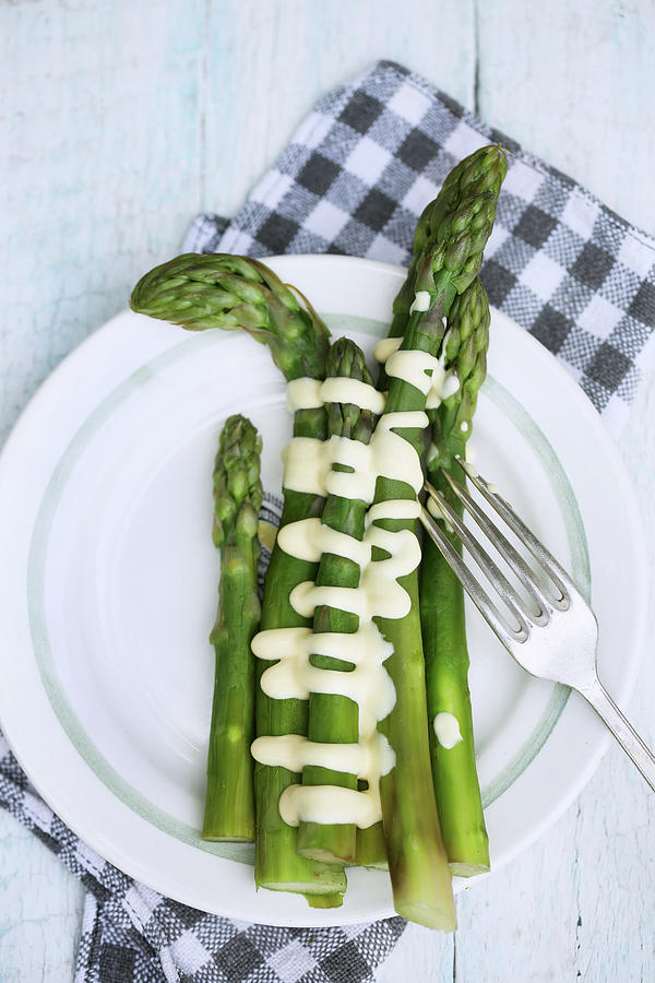 Asparagus with sauce Photograph by Iuliia Malivanchuk