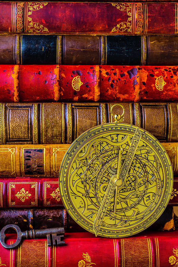Astrolabe And Old Books Photograph by Garry Gay