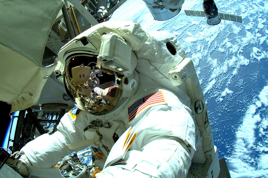 Astronaut at the office Photograph by Steve Kearns