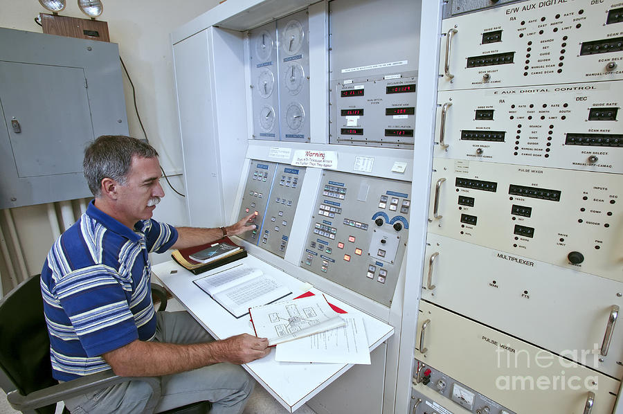 Astronomer At Telescope Control Panel Photograph by Inga Spence