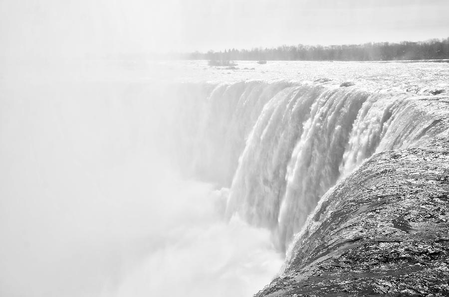 At the Edge of HorseShoe Falls in Black and White Photograph by Bill Cannon