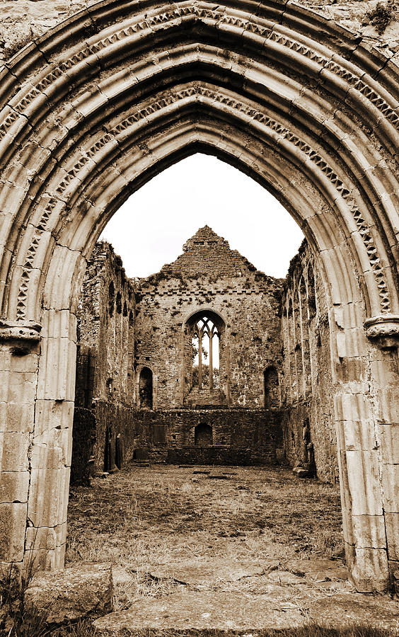 Landmark Photograph - Athassel Priory Tipperary Ireland Medieval Ruins Decorative Arched Doorway Into Great Hall Sepia by Shawn OBrien