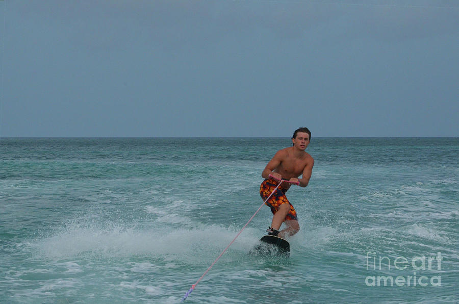 Athletic Wakeboarder in a Crouch off the Coast of Aruba Photograph by DejaVu Designs