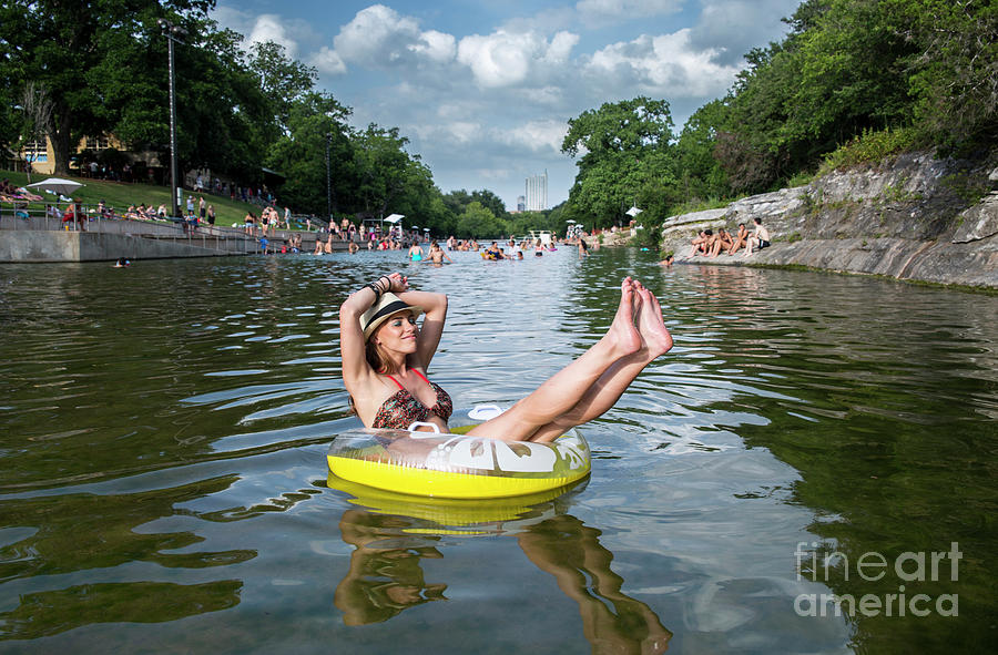 Austin Photograph - Attractive Austin local enjoys the warm sun rays and cool waters by Dan Herron