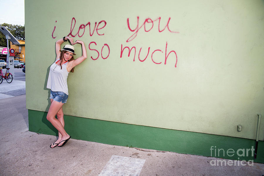 Austin Photograph - Attractive female makes hearts at the I Love You So Much Mural o by Dan Herron