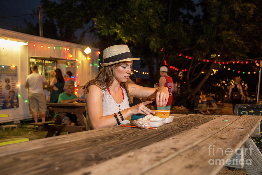Attractive Photograph - Attractive local Austin woman resident eats at an East Austin food truck park by Dan Herron