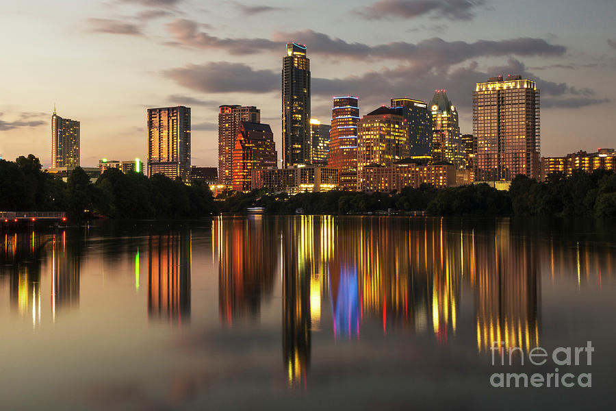 Austin Skyline Photograph - Austin skyline cityscape at night with a glass-like reflection on Ladybird Lake by Herronstock Prints