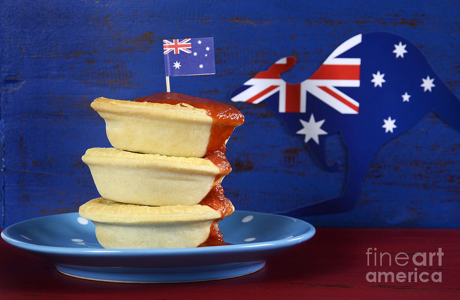 Australian iconic meat pies and tomato sauce  Photograph by Milleflore Images