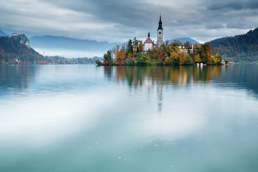 Autumn colours at Lake Bled Photograph by Ian Middleton