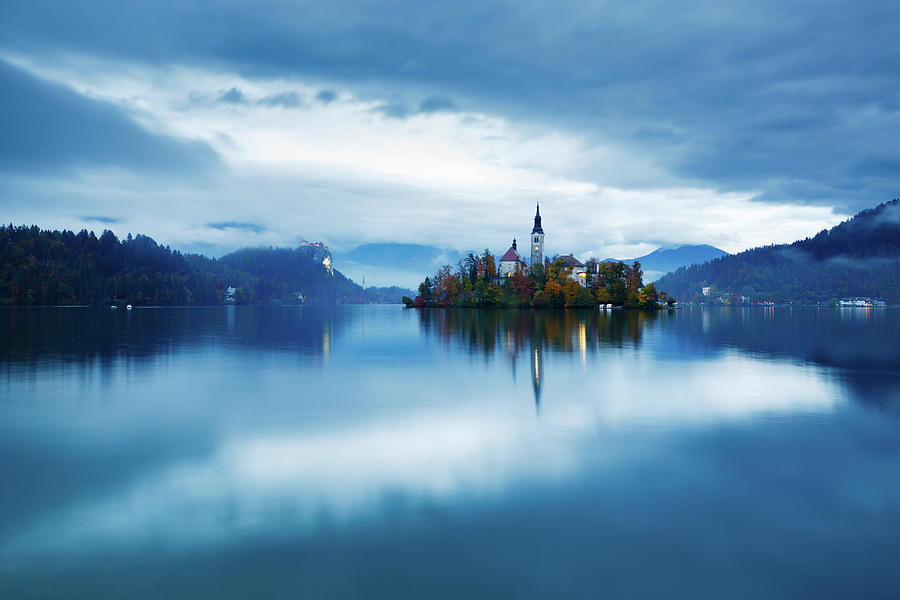 Autumn dusk at Lake Bled Photograph by Ian Middleton
