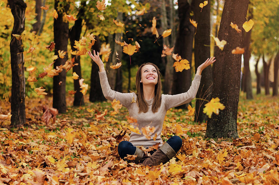 Autumn girl playing in city park. Fall woman portrait of happy lovely and  beautiful young woman in forest in fall colors. Photograph by Ivan Dragiev  | Pixels