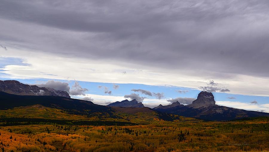 Autumn Storm Clouds Over Chief Mountain Photograph by Tracey Vivar