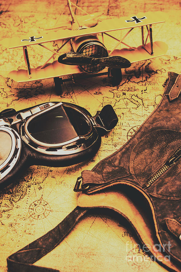 Aviator goggles cap and airplane on old world map Photograph by Jorgo Photography