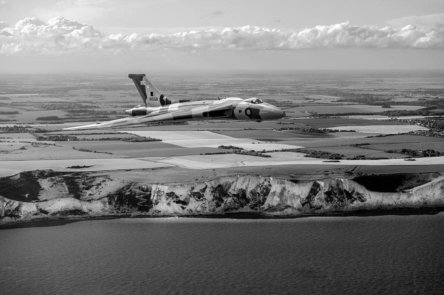 Avro Vulcan over the white cliffs of Dover black and white versi Photograph by Gary Eason