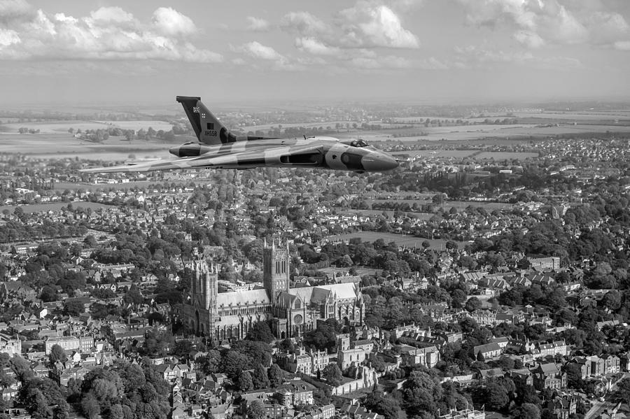 Avro Vulcan passing Lincoln Cathedral black and white Photograph by Gary Eason