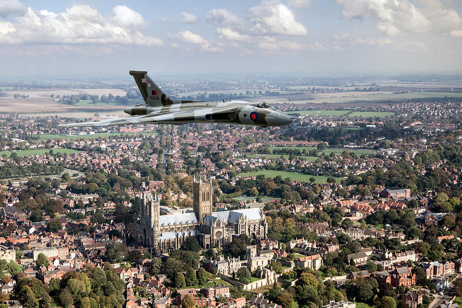 Avro Vulcan passing Lincoln Cathedral Photograph by Gary Eason