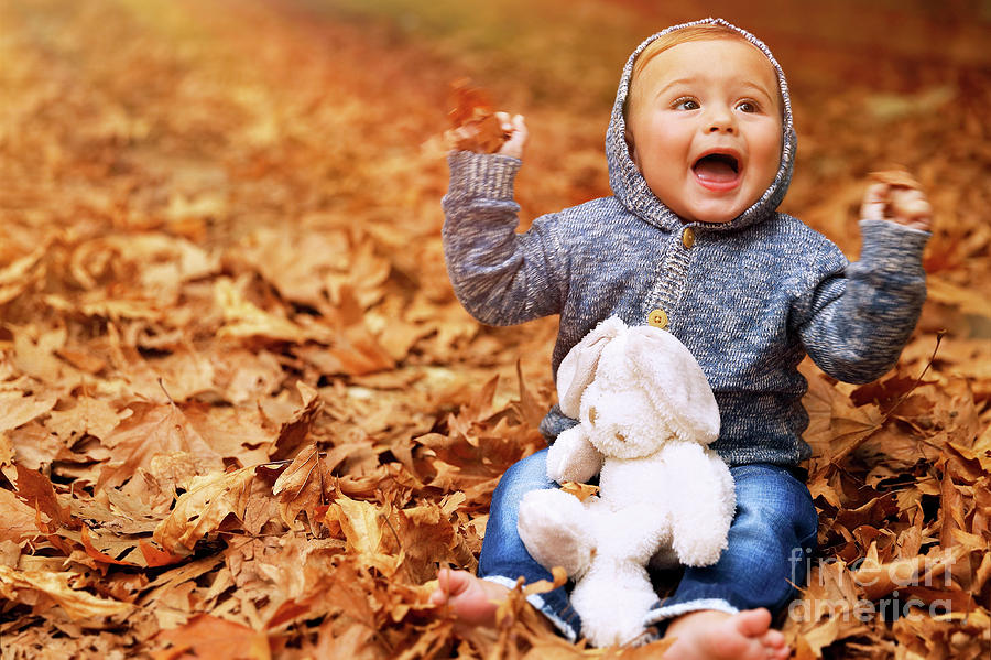 Baby boy playing in autumn park Photograph by Anna Om