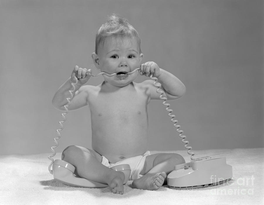Baby Chewing On Telephone Cord, C.1960s Photograph by H. Armstrong Roberts/ClassicStock