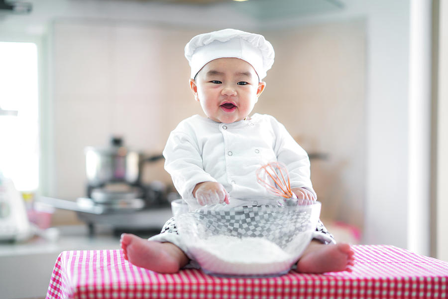 Baby cooking Photograph by Anek Suwannaphoom